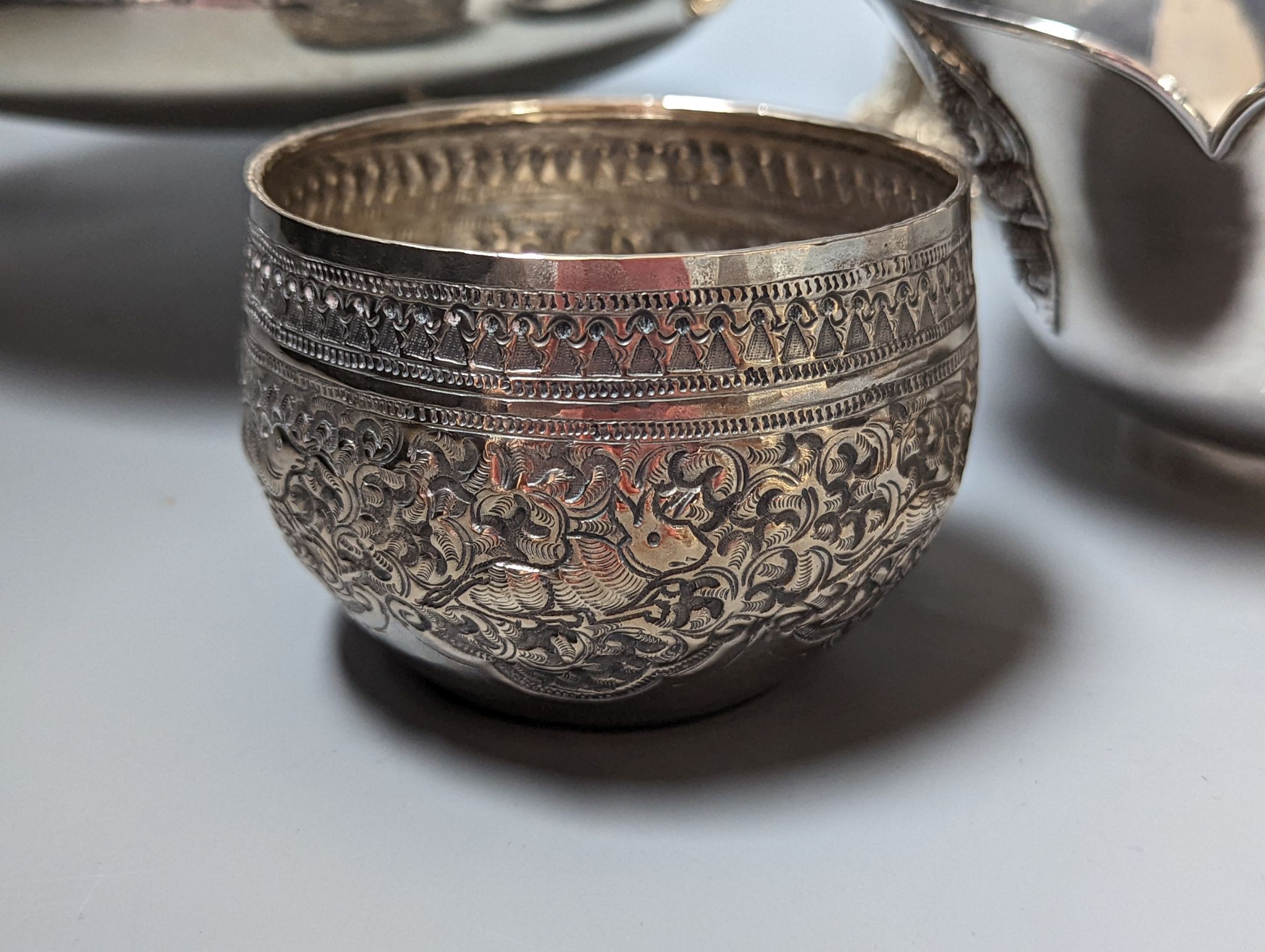 Six assorted embossed white metal bowls, including Indian and Thai, tallest 13.6cm.